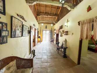 Vaulted ceiling living room with exposed beams tile floor San Carlos Panama