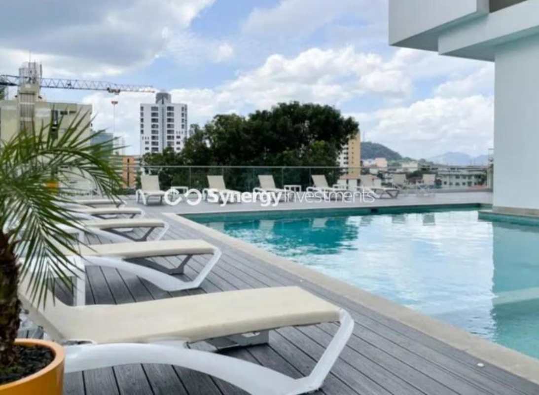 Modern gym with cardio equipment, weights and panoramic skyline views at PH Aqualina