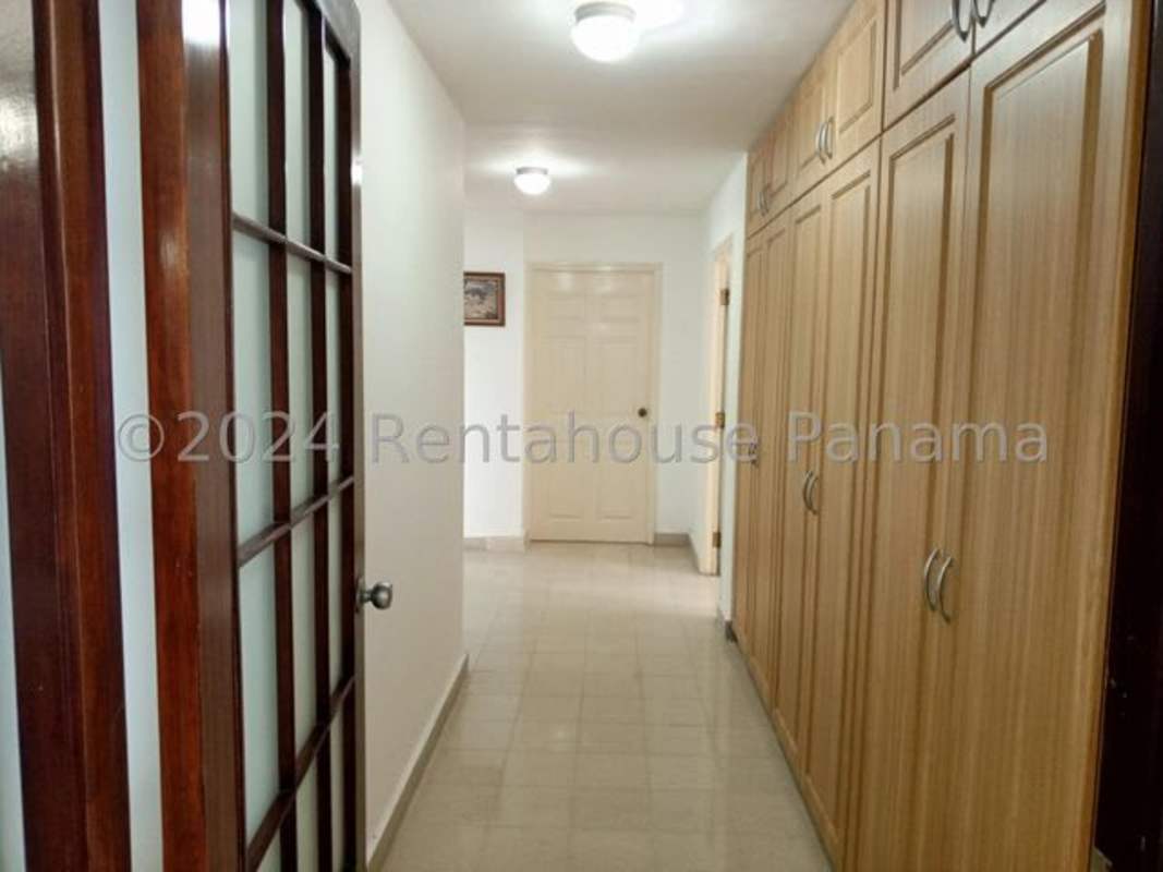 Bright living room with marble floors and balcony access at PH Camino Real in Punta Paitilla Panama