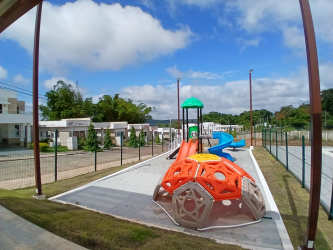 Paved street lined with modern family homes inside Vista Alegre Arraiján Panama