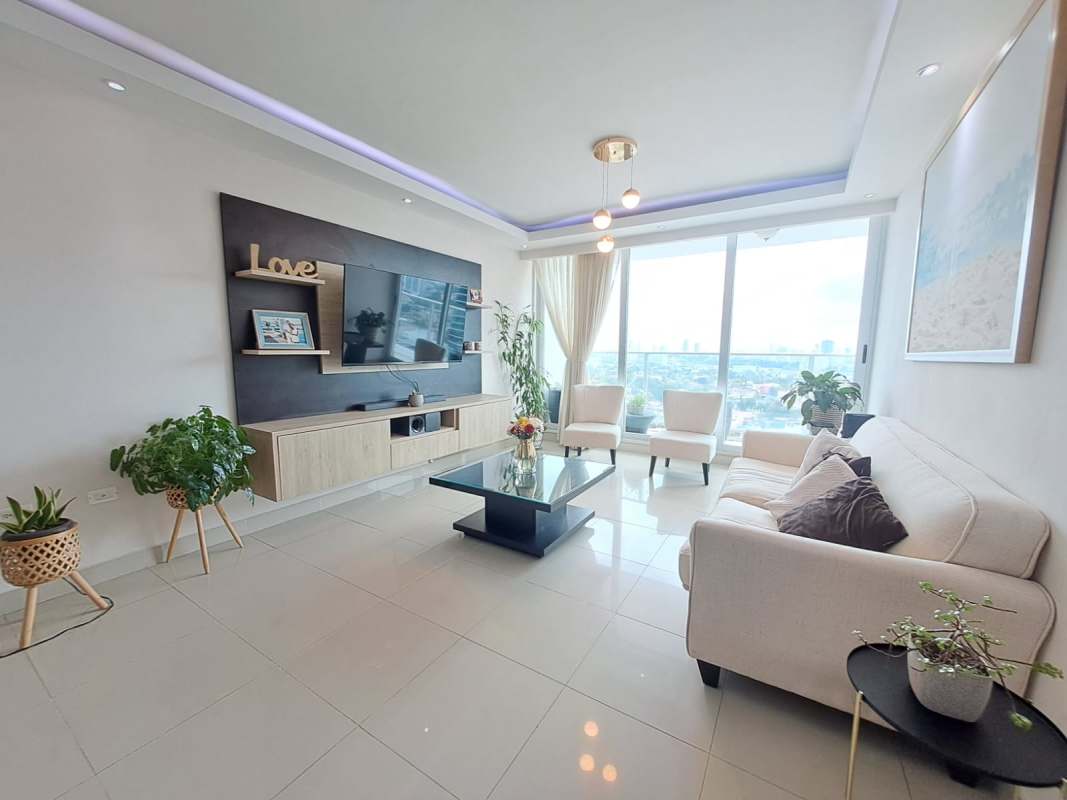 Spacious living area with large city-view windows, tiled floors, and modern finishes in Dos Mares Panama City