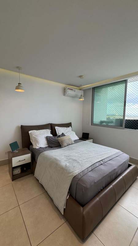 Equipped kitchen with cabinetry and granite-style countertops in PH Sky Point Panama City