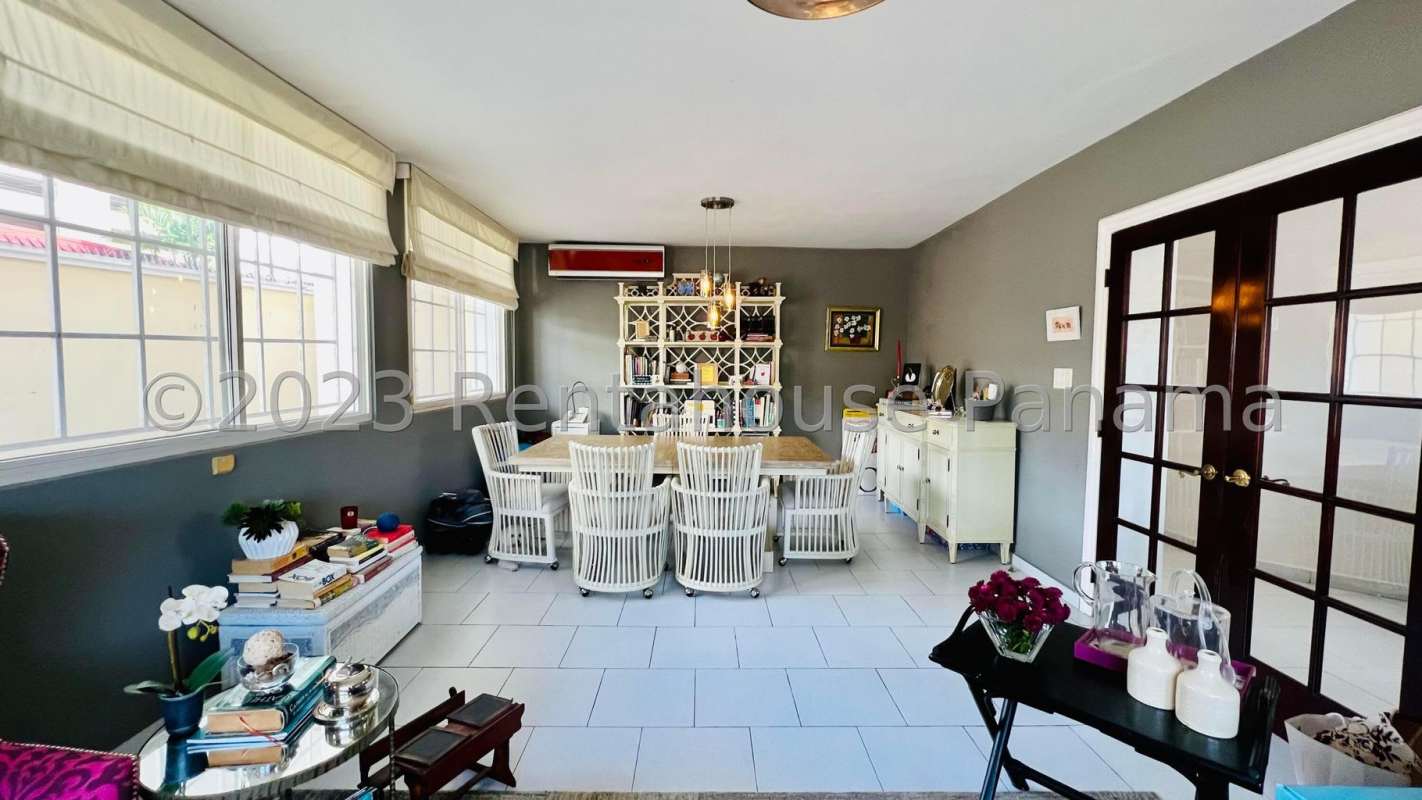Traditional bathroom with decorative blue tiles and pedestal sink in luxury house Altos de Golf Panama