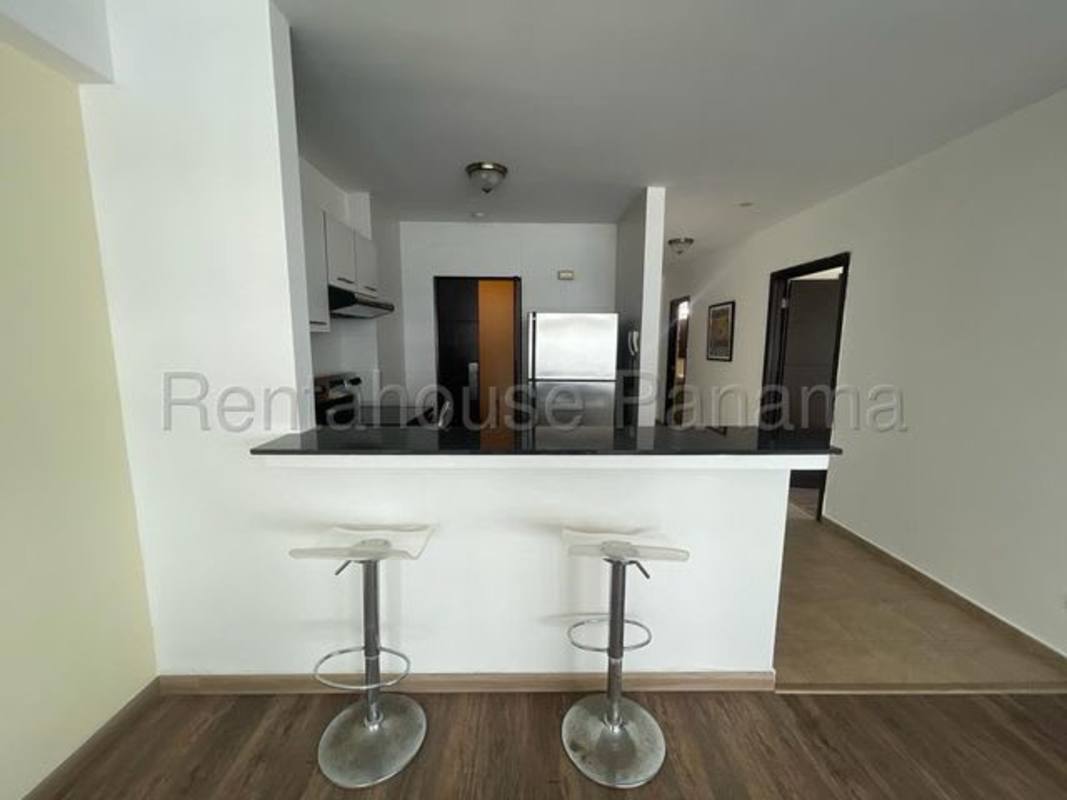 Kitchen with granite countertops and open breakfast bar at PH Bayfront Panama City Avenida Balboa