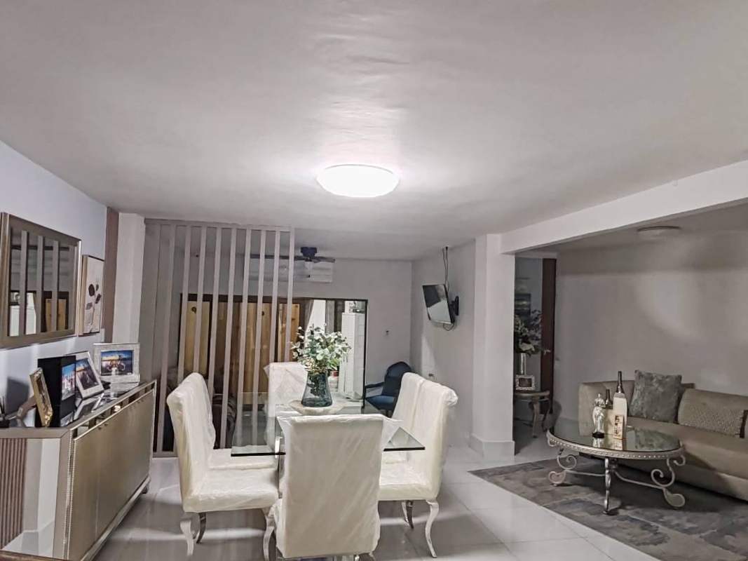 Spacious living room with sofa TV furniture in Panama rental home Condado del Rey