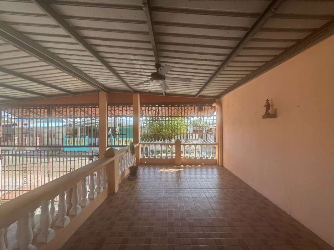 Bedroom with air conditioning, built-in wardrobe and tiled floor in house for sale Colinas del Prado Panama City