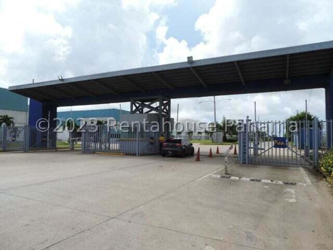 Aerial view industrial warehouse complex red roofs mountain backdrop in Pacora Panama