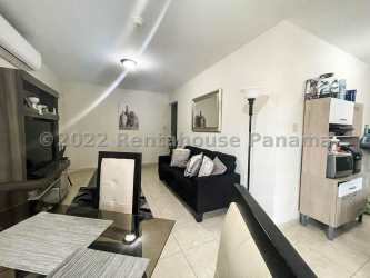 Contemporary kitchen with granite counters cabinets window in La Chorrera home