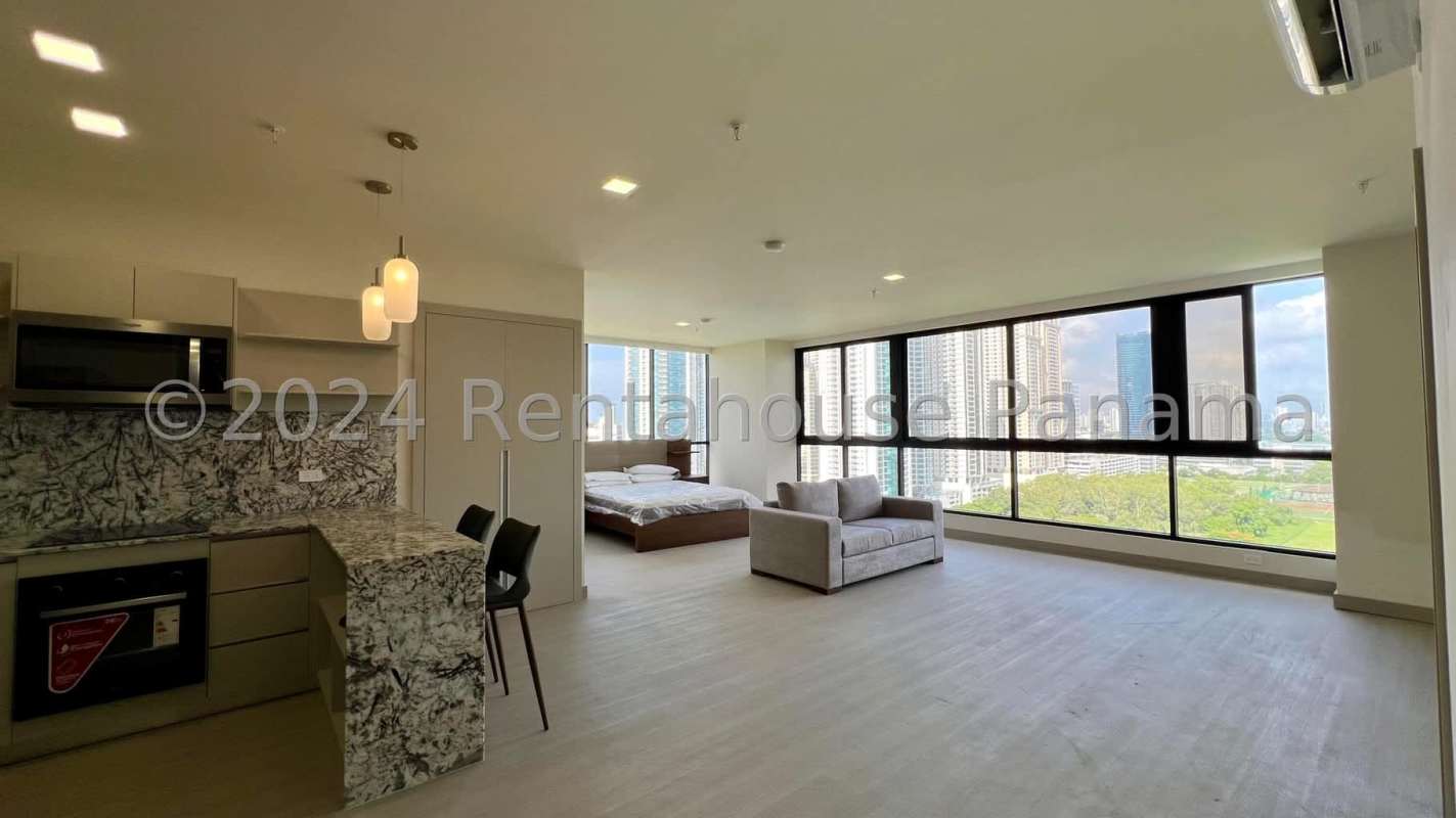 Modern furnished studio with open kitchen, marble counters, panoramic city view in Arcadia Tower Panama