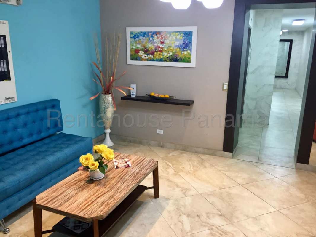 Open living dining space with sectional sofa and breakfast bar at PH Central Park Tribeca Panama City