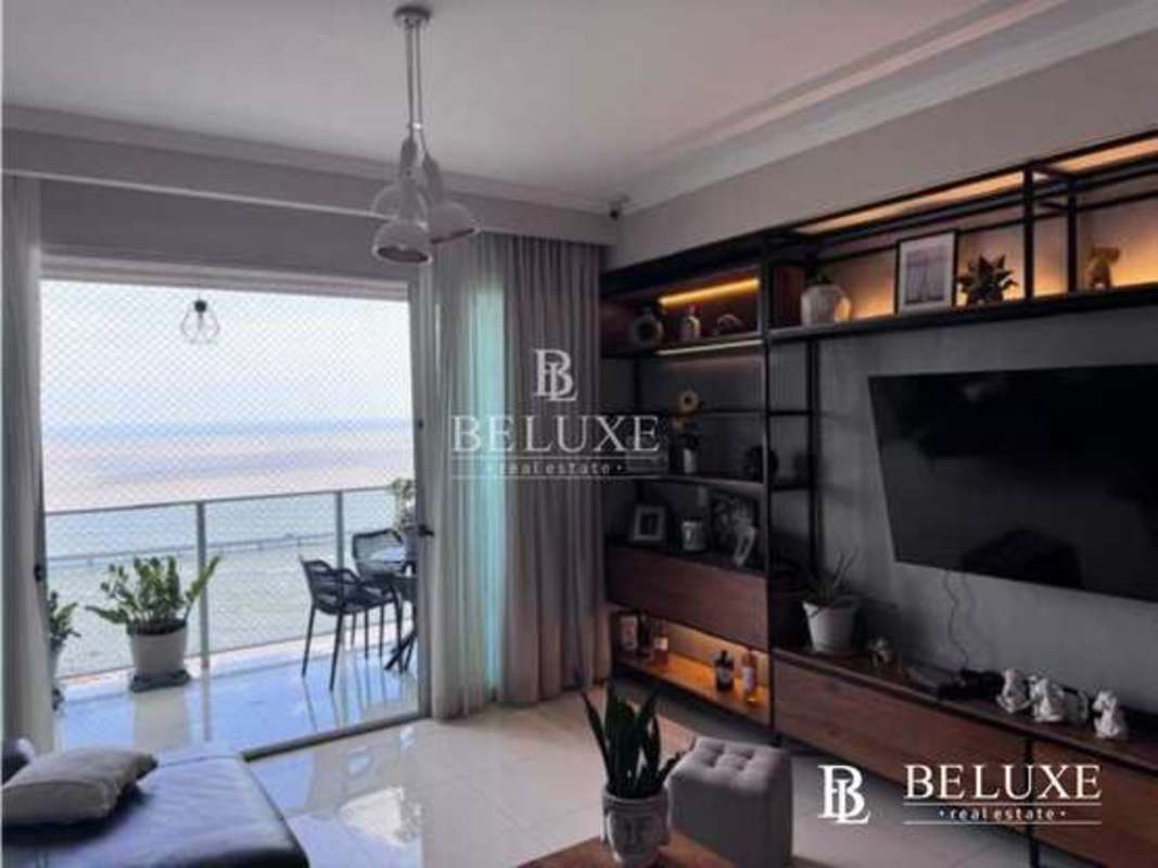 Modern living room with ocean-facing windows in PH Nautica Tower, Coco del Mar