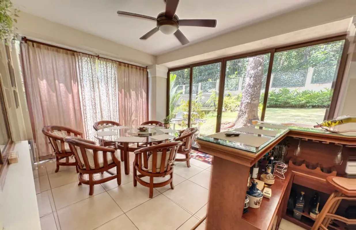 Contemporary living room with double-height ceilings and large windows Senderos de Camino de Cruces Clayton