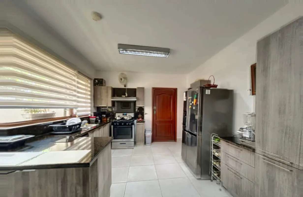 Mediterranean style facade with tile roof and landscaped driveway Clayton Senderos de Camino de Cruces