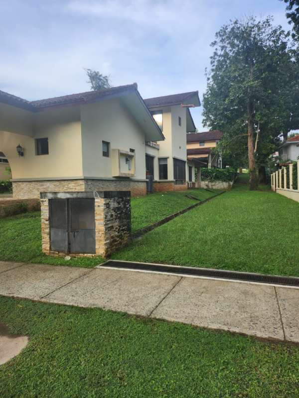 Mediterranean house with pitched roof, stone accents, covered parking in exclusive Senderos Panama