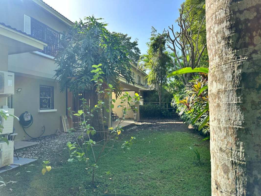 Beautiful landscaped garden with two-story house, mature trees Clayton Panama