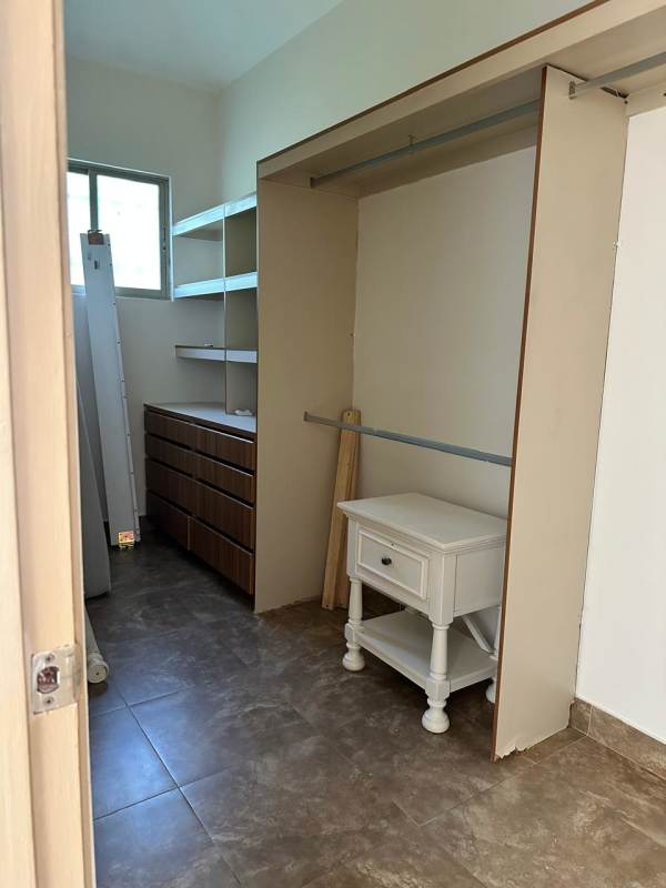 Walk-in closet with built-in shelves and drawers Embassy Gardens Clayton