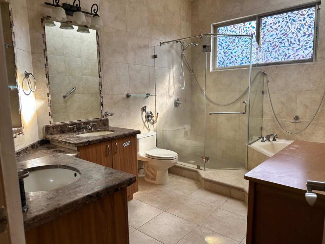 Spacious bathroom with glass shower, double sinks, bathtub Clayton Panama