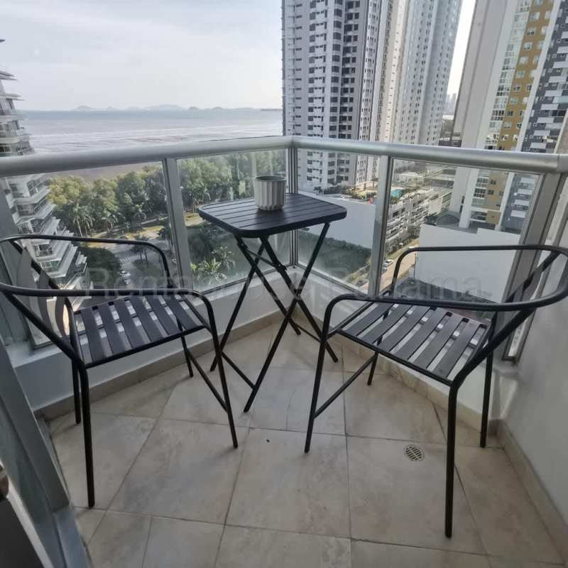 Furnished balcony with black chairs and sea view PH Riverside Costa del Este Panama