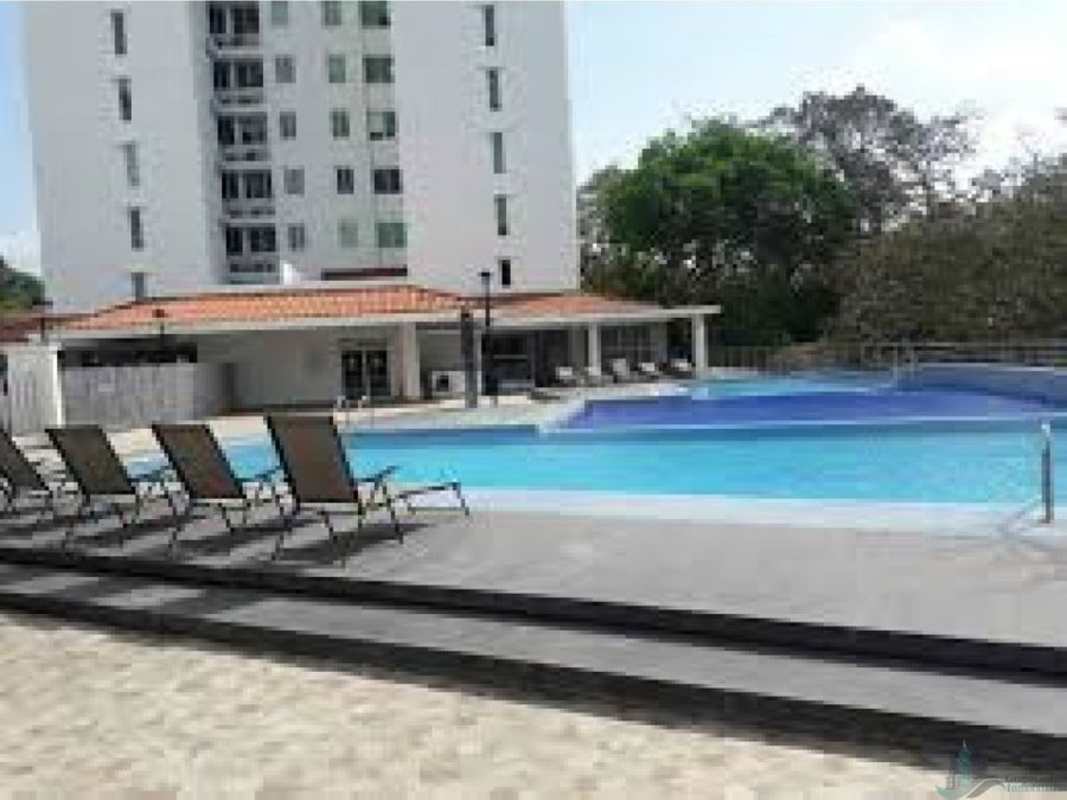 Outdoor swimming pool with lounge chairs at PH Clayton Park Tower Clayton Panama City