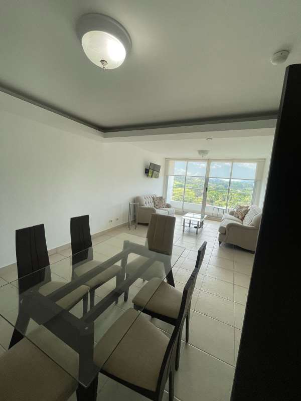 Modern open living dining area with large windows and balcony at PH Clayton Park Panama