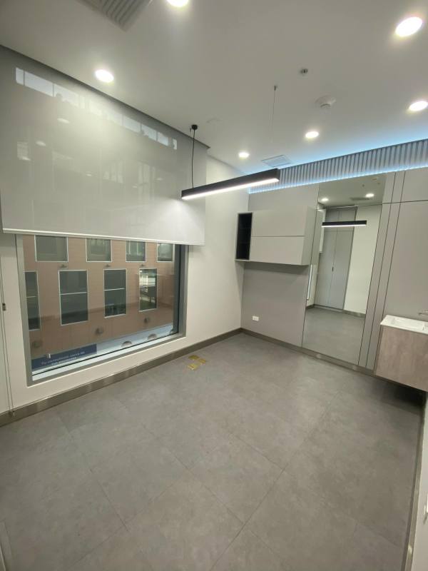 Glass corridor with modern flower decals tiled floor Town Center Costa del Este Panama medical suite