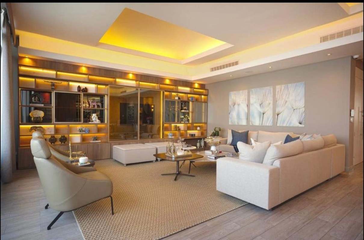 Gourmet kitchen in penthouse with blue cabinets, appliances, dining area PH The Pearl Costa del Este