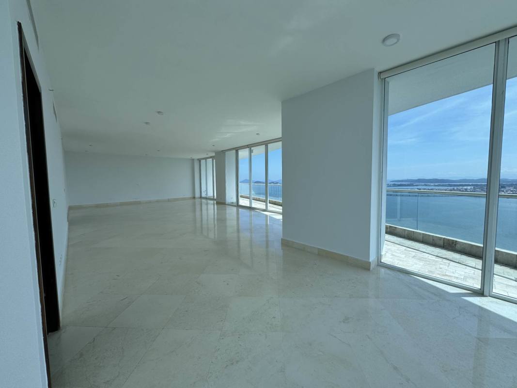 Spacious luxury kitchen with granite countertops stainless appliances dark wood cabinetry in PH The Point Punta Paitilla Panama