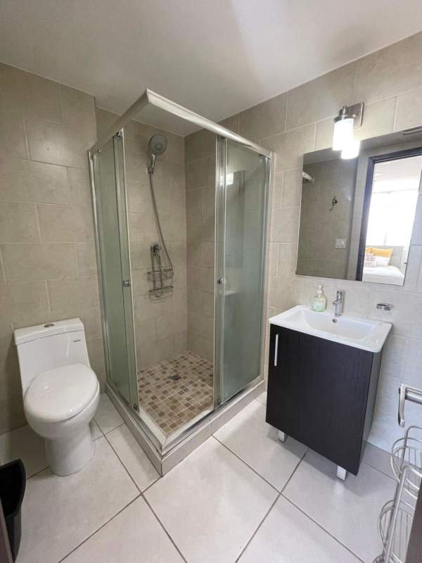 Modern bathroom with glass shower in Bay View Avenida Balboa Panama
