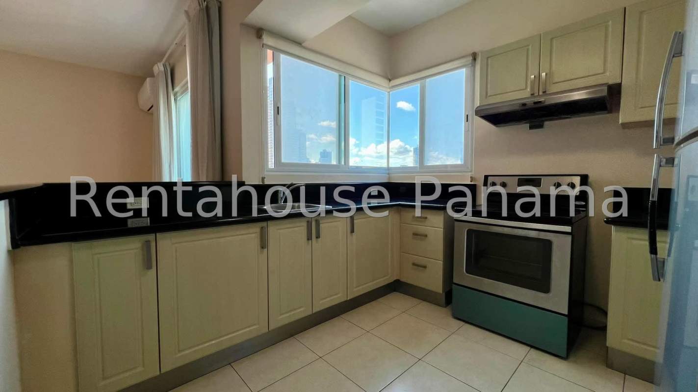 Contemporary kitchen with granite countertops, electric stove and modern cabinets in PH Vista del Mar Avenida Balboa