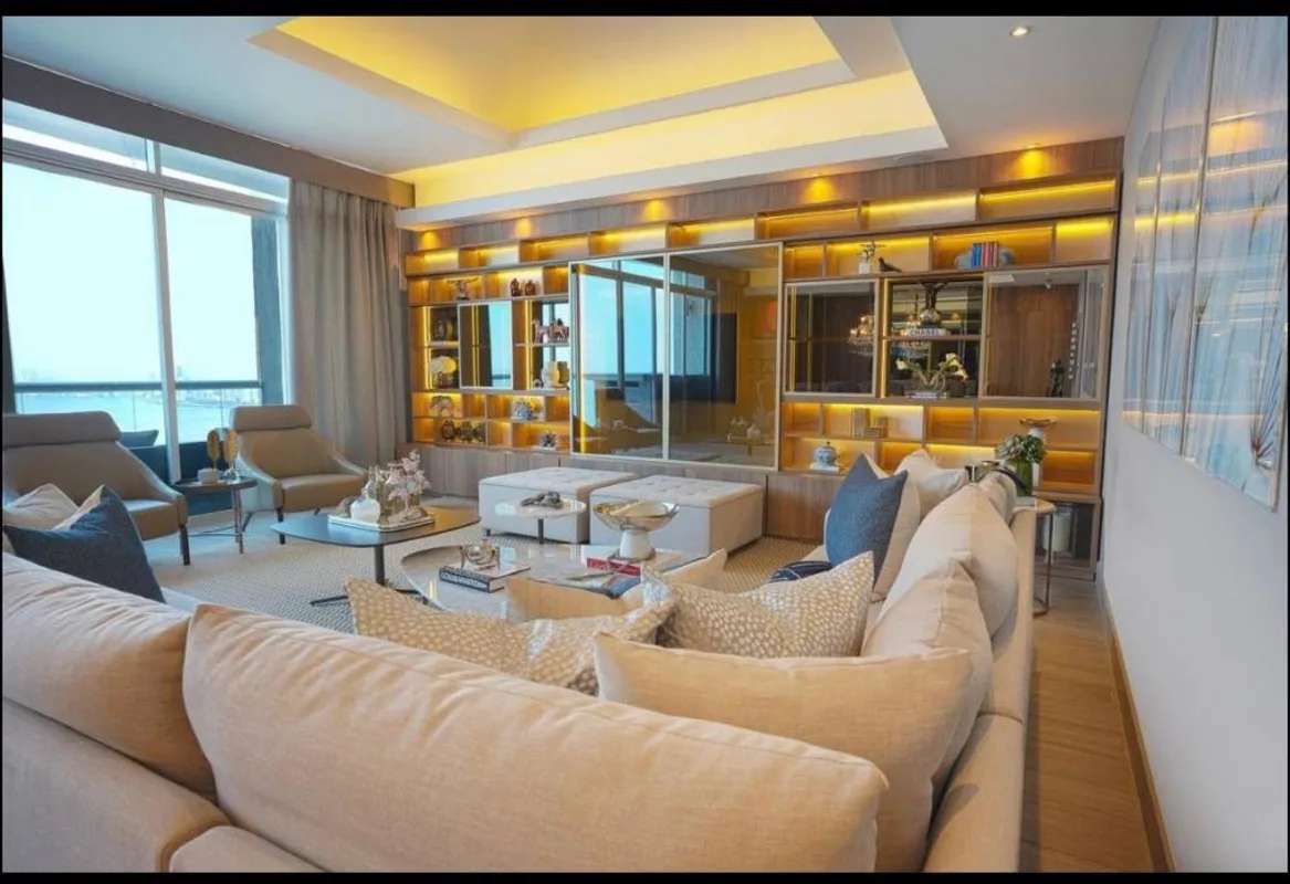 Elegant living room with large windows and panoramic ocean view in PH The Pearl Costa del Este Panama