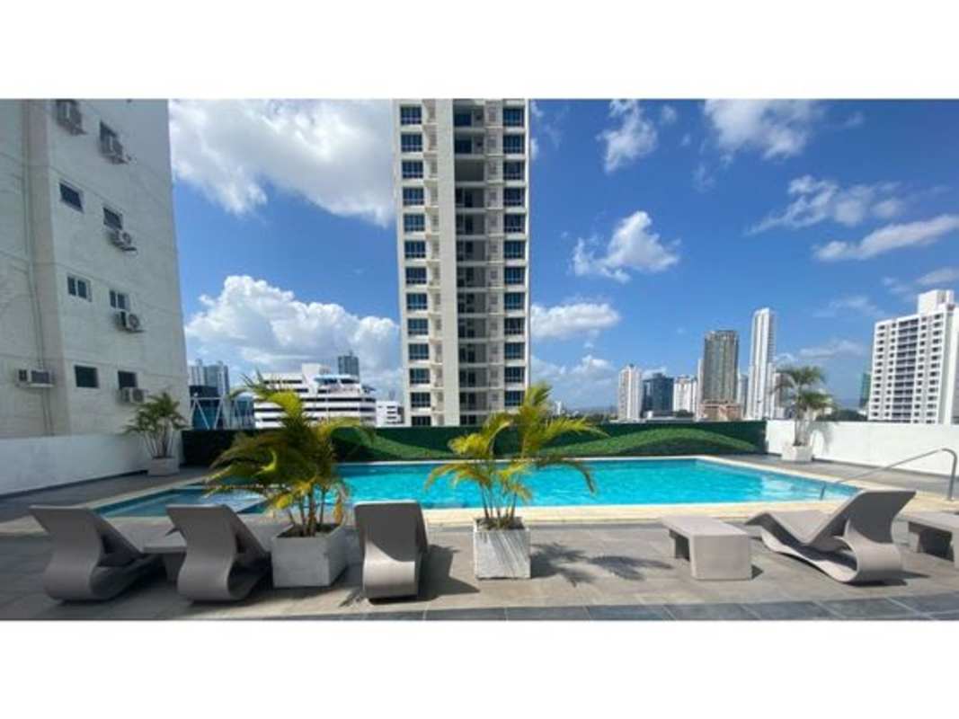 Modern bathroom finished with granite countertop and glass enclosed shower at PH Serenity San Francisco Panama