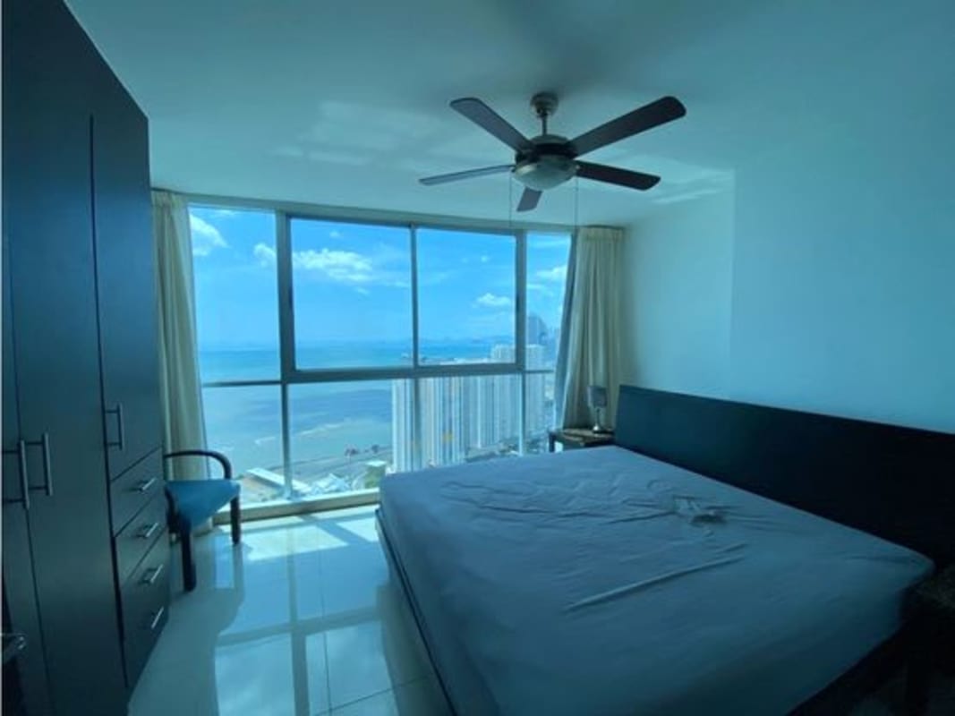 Rooftop pool deck with sun loungers and city skyline at PH Serenity San Francisco Panama