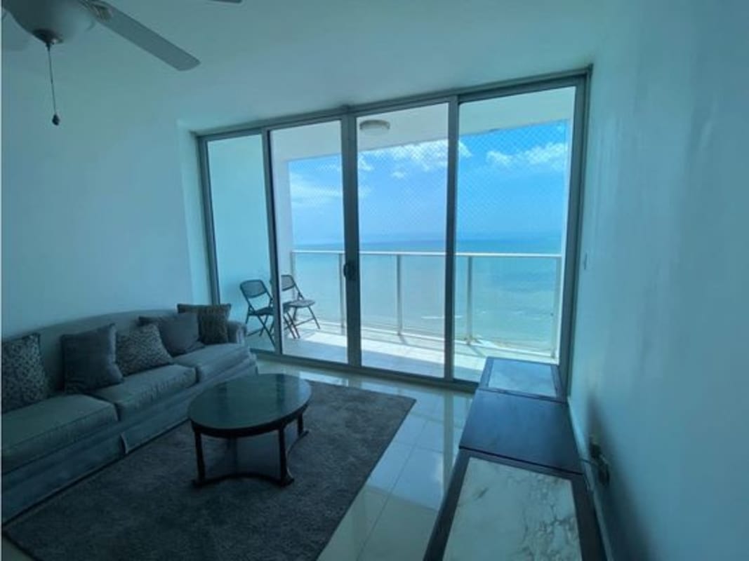 Bright living room with cozy sofas and balcony city view in PH Serenity San Francisco Panama
