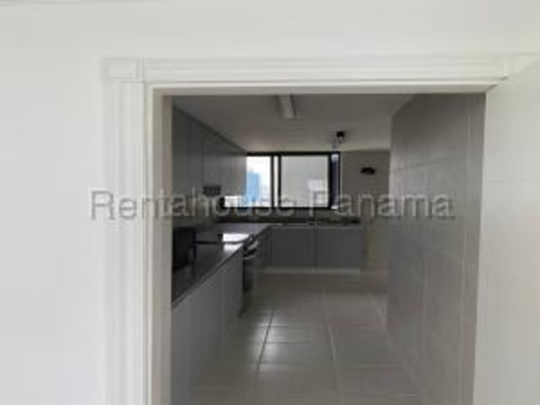 Large closed kitchen with granite countertops and cabinets PH Torres del Pacifico Marbella Panama