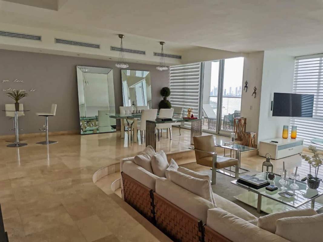 Spacious living area with ocean view balcony at PH Ocean One Punta Pacifica
