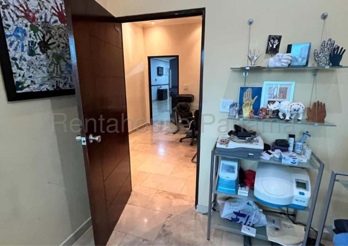 Consulting room interior with built-in cabinetry, sink, marble floor at Pacific Center Punta Pacifica