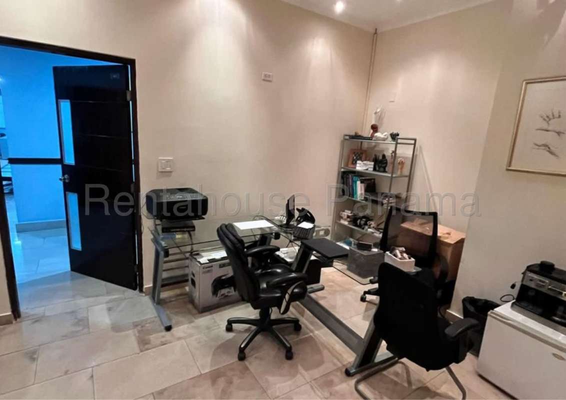 Consultation office interior with marble floor and examination setup Pacific Center Punta Pacifica