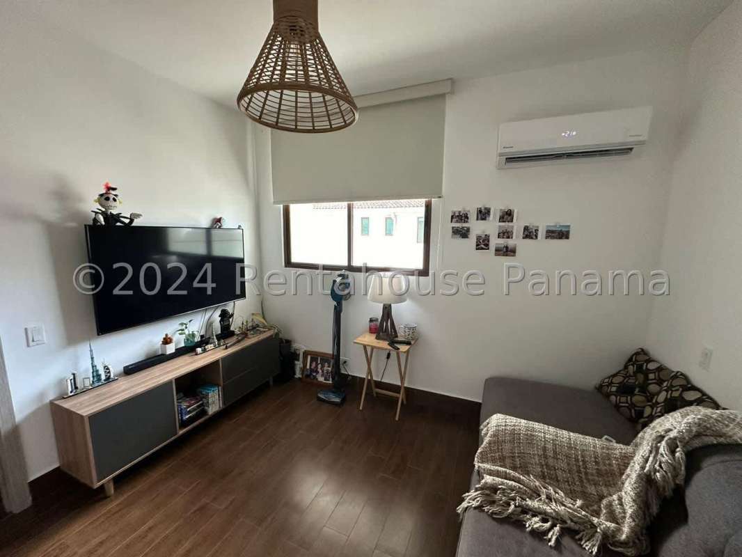 Modern bedroom with natural light built-in closet and pool view PH Costamare Costa Sur Panama