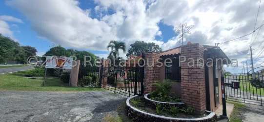 Rustic covered patio with terracotta tiles, garden view and traditional furniture in Punta Chame Panama
