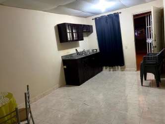 Traditional kitchen with granite countertop and cabinetry in Villa Karla, Arraiján