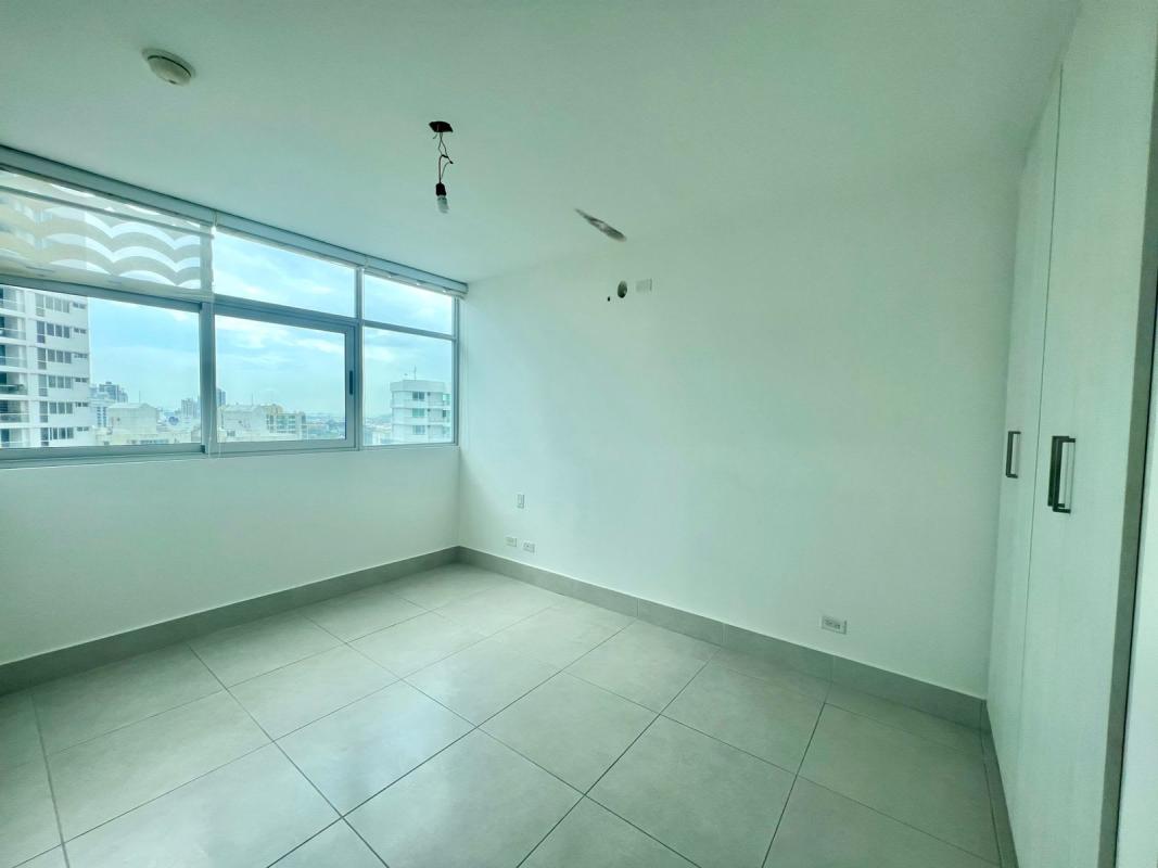 Bedroom with large windows and city view PH Vivendi Green Edison Park Panama City