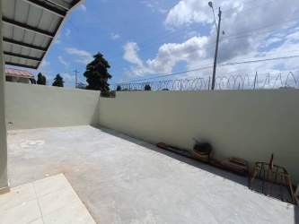 Outdoor patio with fenced walls and partial roof Costa Oeste rental La Chorrera Panama