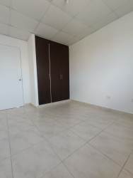 Bedroom with dark built-in closet and tiled floor Costa Oeste rental Panama