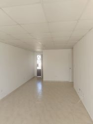 Modern tiled bathroom with pedestal sink and shower in Costa Oeste rental house Panama