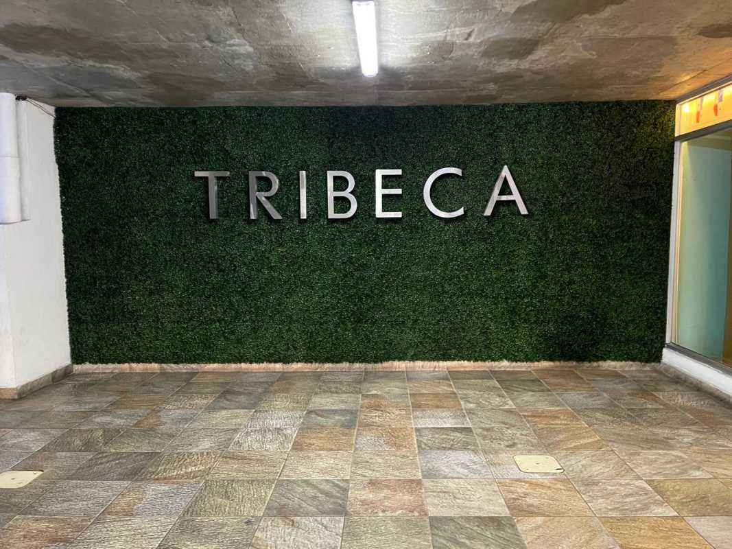 Modern lobby with artificial hedge wall signage TRIBECA at PH Central Park Panama City