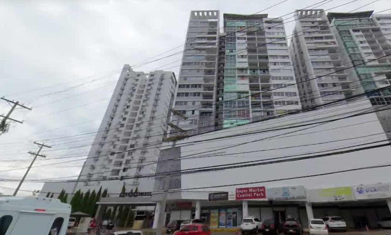 Modern residential tower exterior with commercial shops at PH Central Park Panama City Hato Pintado