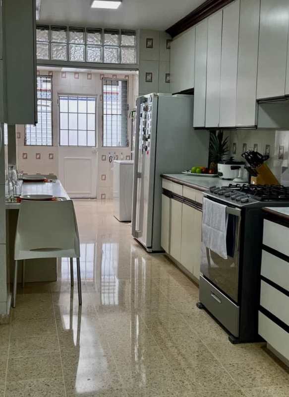 Contemporary kitchen white cabinetry granite countertops breakfast bar Los Flamingos San Francisco Panama