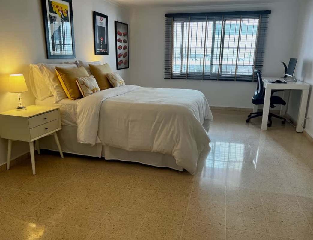 Covered entrance with plants and secure gate at Residencial Los Flamingos Panama