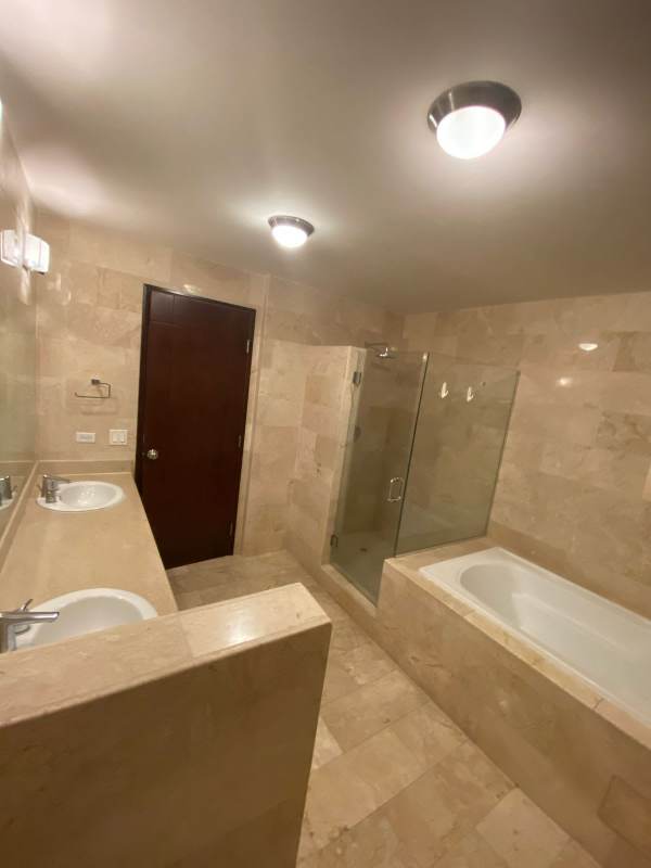 Large luxury bathroom with double sink and tub in PH BICSA Tower