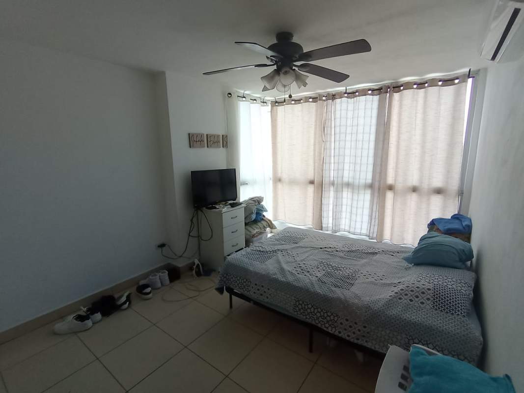 Bedroom with ceramic tiles, built-in closet, ceiling fan and window PH Central Park Tower Broadway